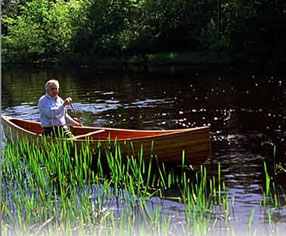 man in canoe